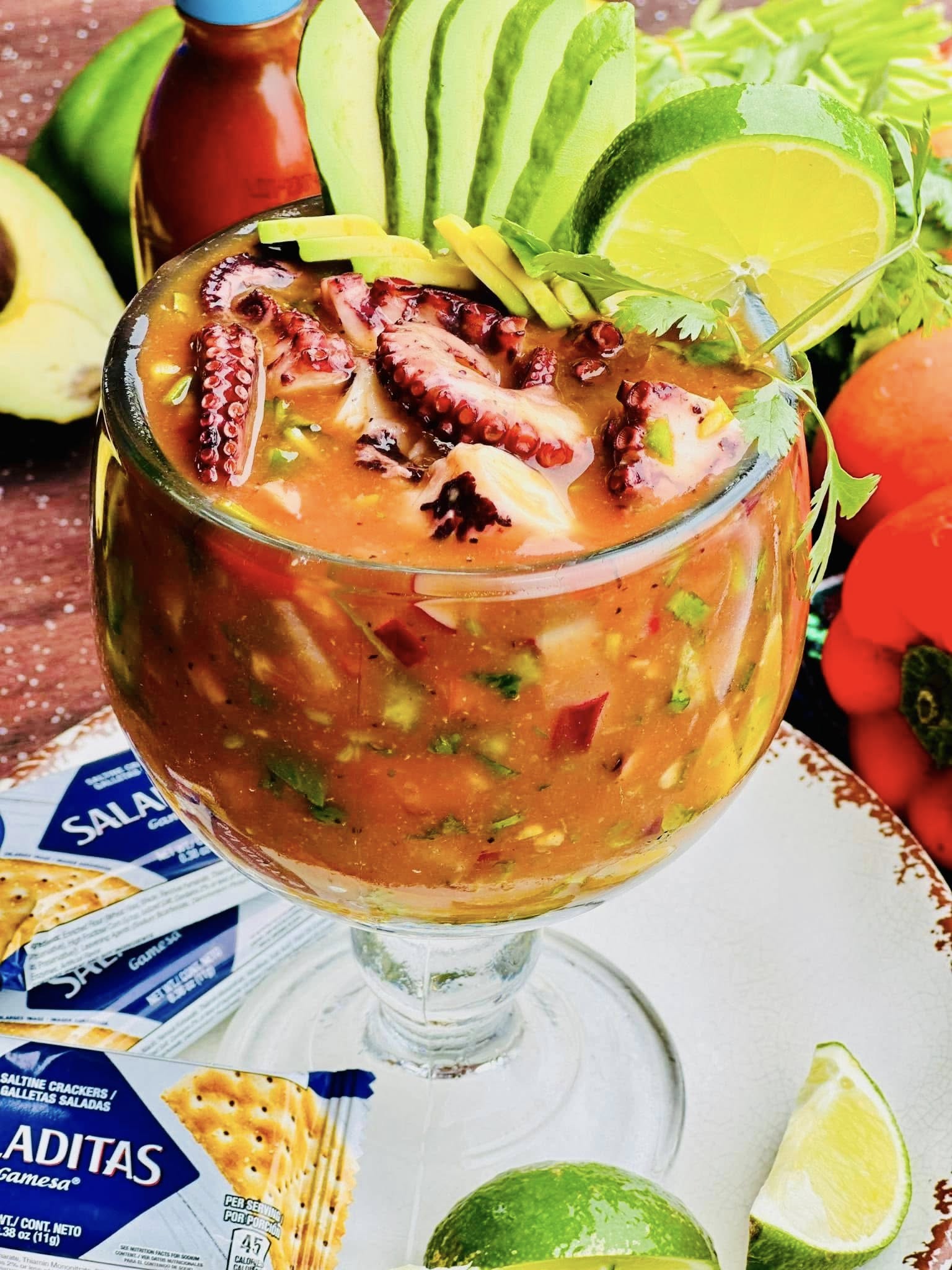 Octopus and seafood cocktail with avocado and lime