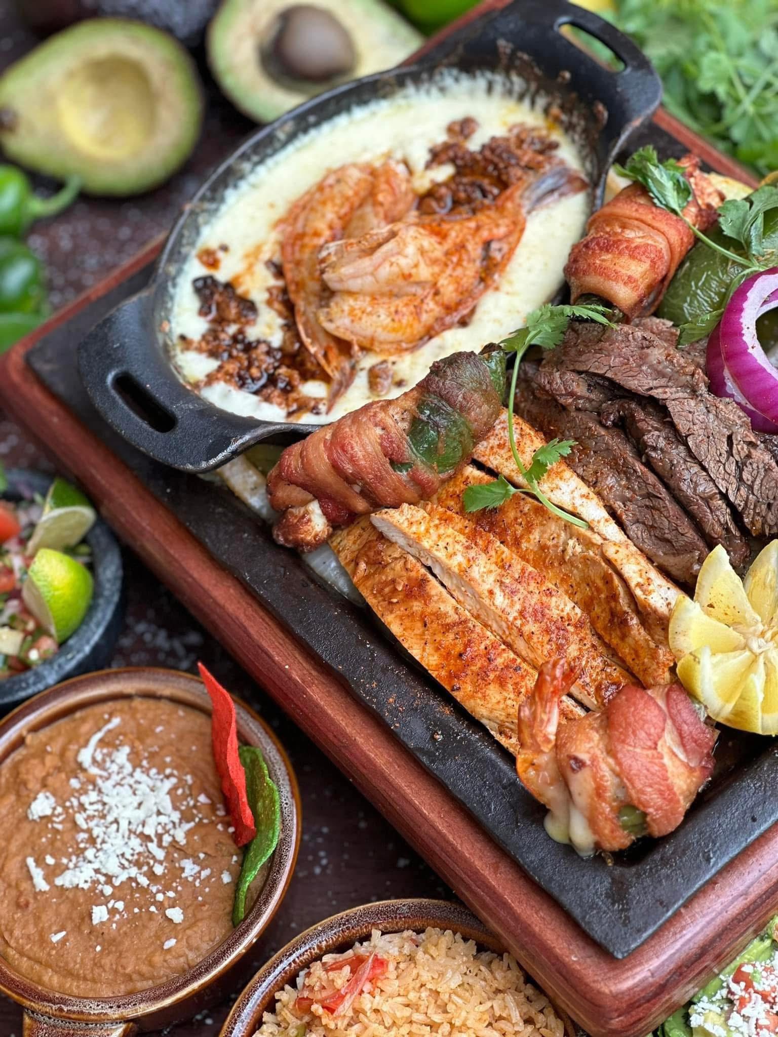 Mixed-grill parrillada platter with shrimp, chicken, and steak